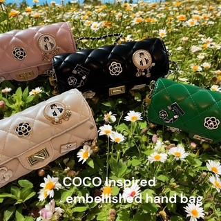 Coco-Inspired Quilted Handbags with Iconic Charms
