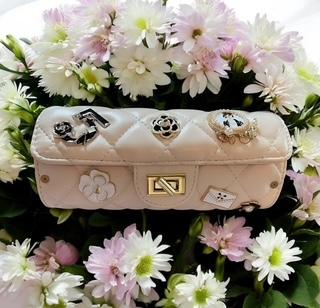 Coco-Inspired Quilted Handbags with Iconic Charms
